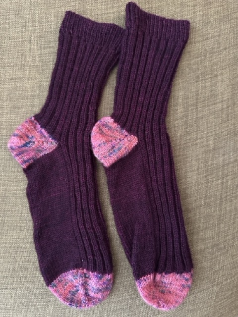 A pair of socks knit up last winter to gift to a friend suffering with literal, as opposed to figurative, cold feet.